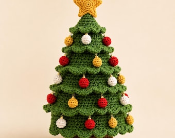May include: A crocheted Christmas tree with a dark brown base and green tiered branches. The tree is decorated with small, round, crocheted ornaments in red, white, and yellow, and is topped with a five-pointed yellow crocheted star.