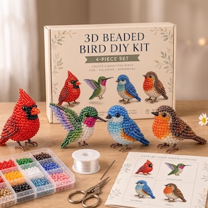May include: A 3D beaded bird DIY kit featuring a box labelled 3D BEADED BIRD DIY KIT, four finished beaded bird figurines including a red cardinal, a green hummingbird, a blue bird, and a brown robin, a bead organiser, thread, and instructions.