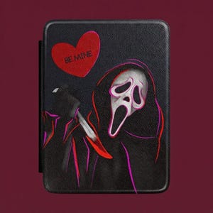 May include: A black e-reader case featuring a graphic of a masked figure in a dark hooded robe holding a knife. Above the figure is a red heart with the text BE MINE printed in black. The design uses neon pink and red outlines on a textured surface.
