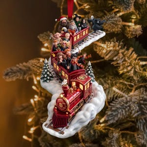 May include: A red train Christmas ornament featuring miniature figures of various characters from the Harry Potter series. The train cars are filled with characters, and the engine is decorated with gold accents, all set upon a white cloud base.