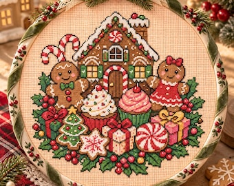 Può includere: Un telaio da ricamo circolare con un disegno a punto croce raffigurante una casa di pan di zenzero, due omini di pan di zenzero, cupcake, regali incartati e un albero di Natale. Il telaio è avvolto da un nastro di velluto verde con bacche.