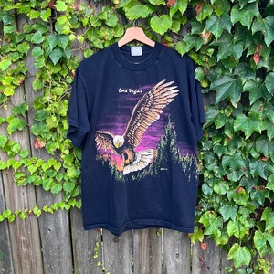 Vintage 90&#39;s Las Vegas Bald Eagle Soaring Hazelwood Black Short Sleeve 100% Cotton T-Shirt Size Large