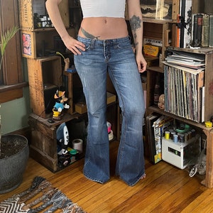 beautiful y2k dark wash low rise flare jeans by a - Depop