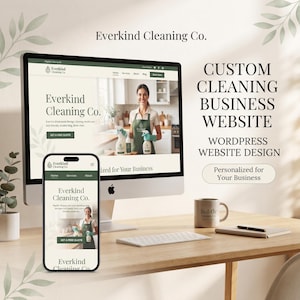 May include: A computer monitor and a smartphone displaying the Everkind Cleaning Co. website design. The screen shows a cleaning service business layout with text, a person in an apron, and cleaning supplies. Includes a mug and notebook.