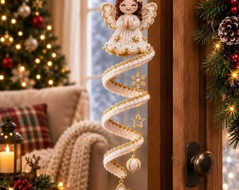 May include: A crocheted angel ornament with brown hair, a white dress, and wings, attached to a long, spiraling white and gold ribbon. The spiral features hanging gold-toned metal snowflake and star charms, a small white sphere, and a star-shaped pendant.