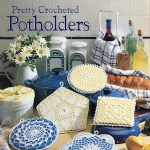 May include: Image of a collection of handmade crocheted potholders in various shapes and designs. The potholders are white with yellow or blue backing. The image also includes a blue pot, a vase of daisies, and other kitchen items.