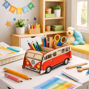 May include: A red and white wooden desk organizer shaped like a vintage Volkswagen bus. The organizer features multiple compartments filled with colored pencils, a wooden ruler, and yellow-handled scissors. It sits on a white desk surface.