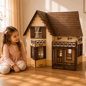 May include: A multi-storey wooden dollhouse featuring a dark brown shingled roof, a front porch with a lattice railing, and windows with dark brown shutters. The structure has light-coloured walls with a brick-patterned base and intricate trim.
