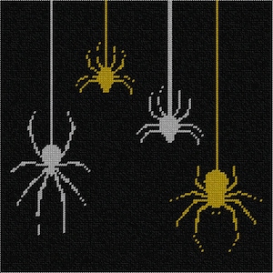 May include: A cross-stitch pattern on a black background featuring four spiders hanging from vertical threads. Two spiders are rendered in metallic gold thread, and two spiders are rendered in silver thread, each with eight legs and a central body.