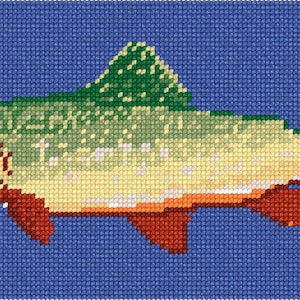 May include: A cross-stitch embroidery pattern of a fish featuring a green and cream-colored body, a dark green dorsal fin, red lower fins, and a textured yellow tail, all set against a solid blue grid background with visible fabric weave.