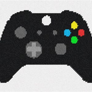 May include: Black video game controller with colorful buttons in a cross-stitch design. The controller features a white center button, gray buttons, and colored buttons in yellow, blue, red, and green. The background is white.