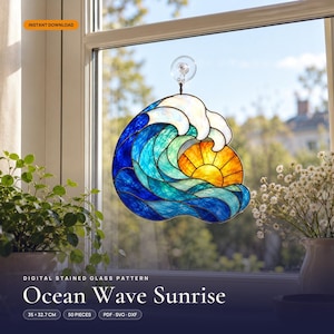 May include: A stained glass suncatcher featuring a blue and teal ocean wave with a white crest and a yellow-orange sun. The design includes the text "INSTANT DOWNLOAD" and "DIGITAL STAINED GLASS PATTERN Ocean Wave Sunrise 35 x 32.7 CM 50 PIECES PDF SVG DXF".