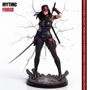 May include: A collectible figurine of a warrior in a black tactical suit with red accents, wearing a mask and holding a katana. The base is made of grey rubble. Text on the image reads MYTHIC FORGE and MYTHIC FORGE STUDIOS | FORGING LEGENDS IN EVERY DETAIL.