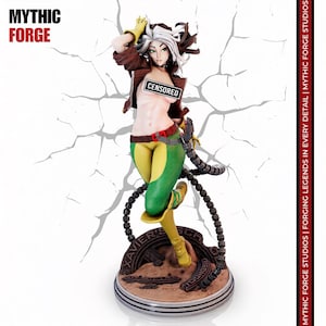 May include: A collectible figurine of a character with brown hair and a white streak, wearing a brown jacket, green pants, and yellow gloves. The figure stands on a circular base labeled XAVIER'S SCHOOL, with a black CENSORED bar across the chest.
