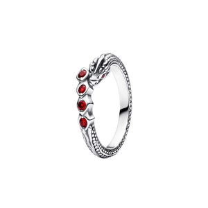 May include: A silver ring shaped like a coiled snake with a textured scale pattern along the band. The head of the snake features a small red stone eye, and the body is accented with four round, vibrant red stones set in a vertical row.