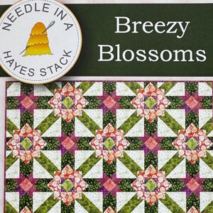 May include: A quilt pattern titled "Breezy Blossoms" with a repeating floral design in shades of green, pink, and white. The quilt measures 60 inches by 72 inches. The pattern is from Island Batik and Hayes Stack.