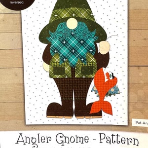May include: A pattern for an applique gnome holding a fish. The gnome is wearing a green and brown hat, a plaid shirt, and brown pants. The fish is orange and has a white mouth. The pattern includes a finished drawing and templates for assembling the applique. The finished size is 6 1/2 inches by 10 1/2 inches. The pattern is titled "Angler Gnome - Pattern" and is by Leanne Anderson 2022.