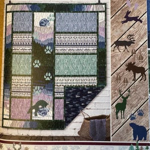 May include: A brochure for a Nordic Tracks Block Blanket with 6 animal appliqués. The blanket features a patchwork design with various patterns and animal paw prints. The brochure also includes illustrations of animals like a deer, moose, and bear, with the text "Scandinavian Winter".