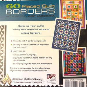 May include: A softcover book titled 60 Pieced Quilt Borders by Judy Laquidara, featuring a black background with colorful geometric border patterns, three quilt illustrations, instructional text, the American Quilter's Society logo, and a barcode.
