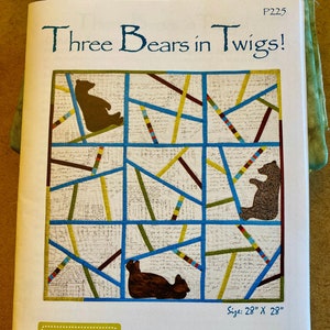 May include: A quilt pattern featuring three bears in a design of twigs. The quilt is 28 inches by 28 inches. The pattern is called "Three Bears in Twigs!" and is a modern wall art quilt. The text reads: "The crissing and crossing of twigs, the slicing and dicing of fabric blocks, and the charming lives of three bears."