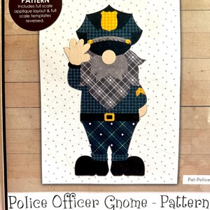 May include: A printable pattern for a police officer gnome applique. The pattern includes a full-scale layout and templates for assembling the applique. The finished size is 5 1/2 inches by 11 1/2 inches. The pattern is titled "Police Officer Gnome - Pattern" and includes the text "The Whole Country Caboodle" and "Leanne Anderson 2022".