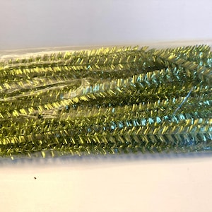 May include: A package of green metallic pipe cleaners. The pipe cleaners are in a clear plastic bag and are ready to be used for crafts.