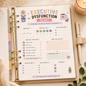 May include: A planner page titled Executive Dysfunction Reset with pastel illustrations of a flower and coffee mug. The layout includes sections for date, mood tracking, reset plan steps, focus goals, and lists for help, tools, and accomplishments.