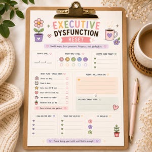 May include: A paper planner sheet on a wooden clipboard titled Executive Dysfunction Reset. It features sections for date, mood, tasks, and goals with pastel illustrations of flowers and a coffee mug. Text includes Small steps. Less pressure. Progress, not perfection.