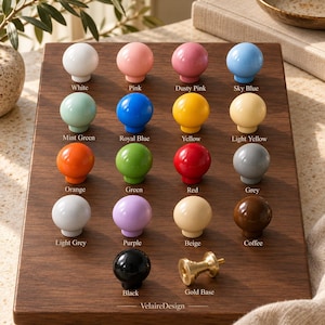 May include: A collection of sixteen round cabinet knobs in various colors including white, pink, dusty pink, sky blue, mint green, royal blue, yellow, light yellow, orange, green, red, grey, light grey, purple, beige, coffee, and black.