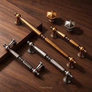 May include: A collection of metal cabinet hardware including three long drawer pulls and two hexagonal knobs. The hardware features a distressed finish in both antique gold and silver tones. The text VelaireDesign is visible at the bottom.