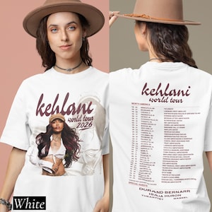 May include: A white t-shirt featuring a graphic of Kehlani with the text Kehlani World Tour 2026 on the front. The back of the shirt displays a list of North American tour dates and venues in dark red text, including special guests Durand Bernarr.
