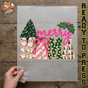 May include: A heat transfer design featuring the word MAMA in large block letters with a pink script merry above it. The letters feature patterns of Santa faces, pink and white diagonal stripes with a pink bow, green polka dots, and Christmas trees.