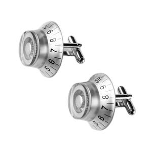 May include: A pair of silver-toned cufflinks shaped like audio equipment control knobs. Each cufflink features a circular, translucent top with black printed numbers ranging from 5 to 10, a central ridged dial, and a standard hinged T-bar fastener.