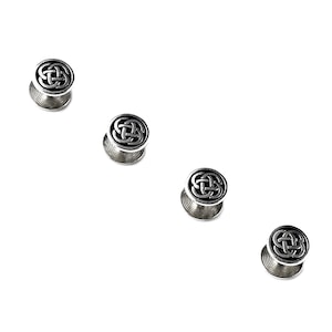 May include: Set of four silver-toned shirt studs with a Celtic knot design.