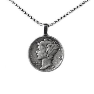 May include: Silver necklace with a 1943 Mercury dime pendant. The pendant features a profile of Liberty with the inscription "IN GOD WE TRUST" and "LIBERTY" on the coin.