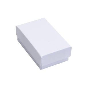 May include: A white cardboard box with a smooth, matte finish. The box is rectangular and has a lid.