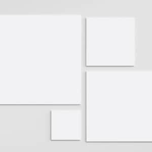 May include: A collection of four blank white square canvases arranged in a cluster. The set includes one large square, one medium square, and two smaller square canvases, all featuring clean, flat, white surfaces with sharp, defined edges.