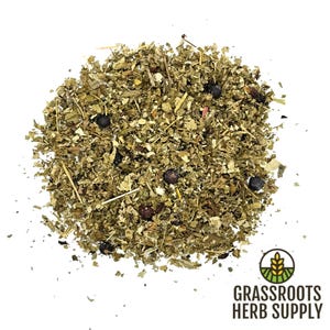 May include: A close-up of a pile of dried herbs and berries, including juniper berries, for making herbal tea. The herbs are a mix of green and brown, and the berries are dark blue. The image is labeled "Grassroots Herb Supply".