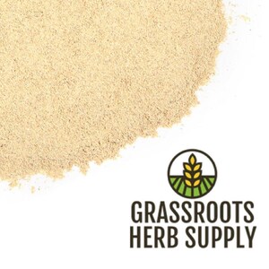 May include: A close-up of a pile of light beige powder. The powder is a natural herb supplement. The image is labeled "GRASSROOTS HERB SUPPLY".