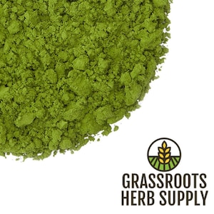 May include: A close-up of a pile of green matcha powder. The powder is finely ground and has a vibrant green color.