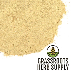 May include: Close-up of a pile of light brown powder, possibly a spice or herb. The image includes the logo for Grassroots Herb Supply, featuring a wheat stalk and the company name.