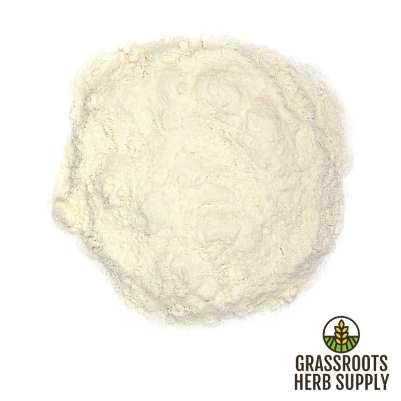 May include: A close-up view of a pile of off-white powder. The powder is finely ground and has a smooth texture.