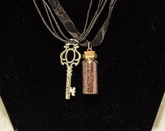 Etheral Essence glitter in a bottle and skeleton key steampunk necklace