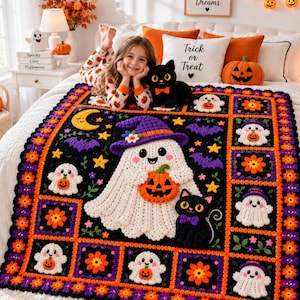 May include: A handmade crochet Halloween blanket featuring a large central ghost wearing a purple hat and holding an orange pumpkin, surrounded by smaller ghost, black cat, and floral motifs in black, orange, purple, and white yarn colors.