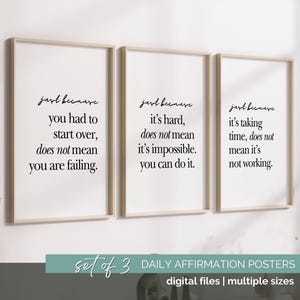 May include: Three framed posters with motivational quotes in black script on a white background. The posters are in light wood frames. The bottom of the image has text that reads "Set of 3 Daily Affirmation Posters".