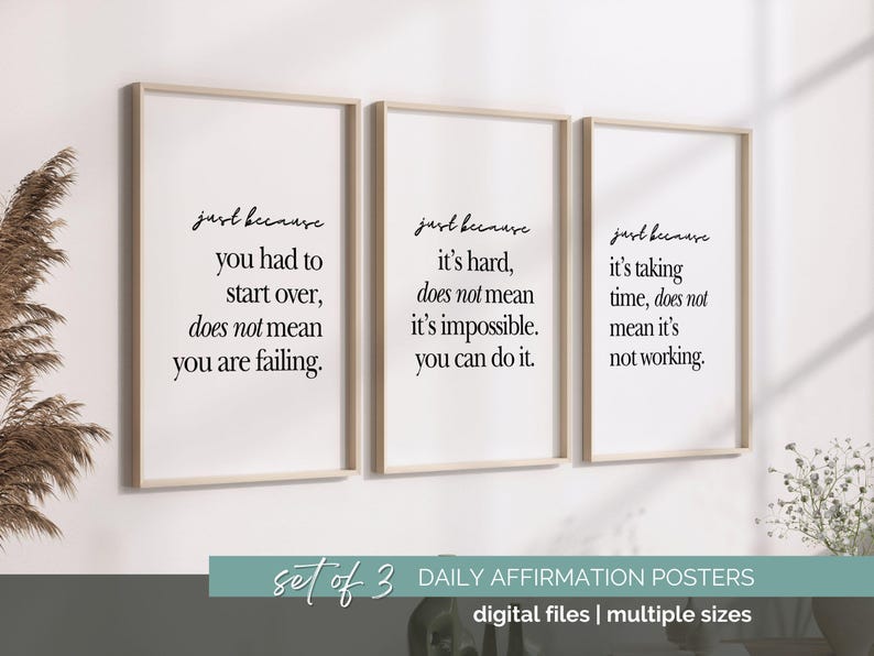 May include: Three framed posters with motivational quotes in black script on a white background. The posters are in light wood frames. The bottom of the image has text that reads "Set of 3 Daily Affirmation Posters".