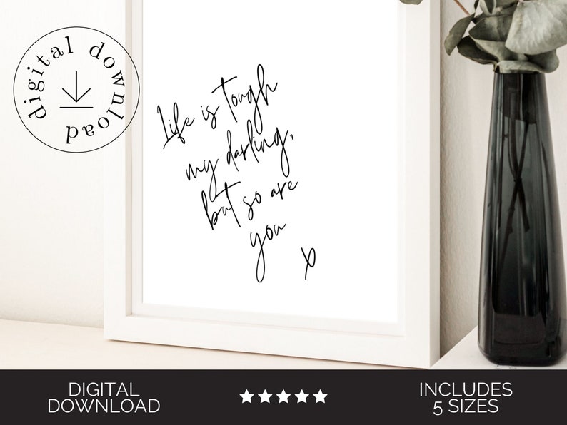 May include: A white framed printable with black calligraphy that reads "Life is tough my darling, but so are you."