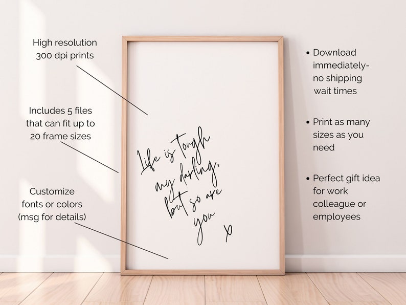 May include: A printable quote that reads "Life is tough, my darling, but so are you." The quote is framed in a light wood frame and is set against a white wall.