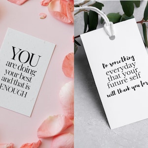 May include: Two white cards with black text. One card reads "YOU are doing your best and that is ENOUGH." The other card says "Do something everyday that your future self will thank you for."