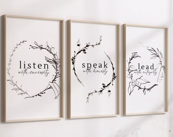 May include: Three framed prints with black and white floral illustrations and inspirational quotes. The quotes are "listen with curiosity", "speak with honesty", and "lead with integrity".